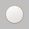 Round Copper mirror on a grey background