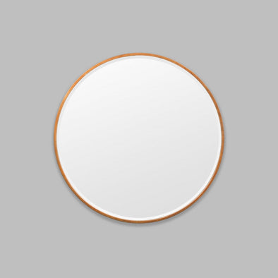 Round Copper mirror on a grey background