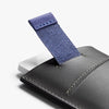 Gray leather wallet with a blue fabric strap on a white background