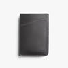 Black leather wallet with 'bellroy' branding on a light gray background