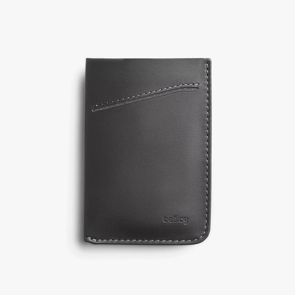 Black leather wallet with 'bellroy' branding on a light gray background