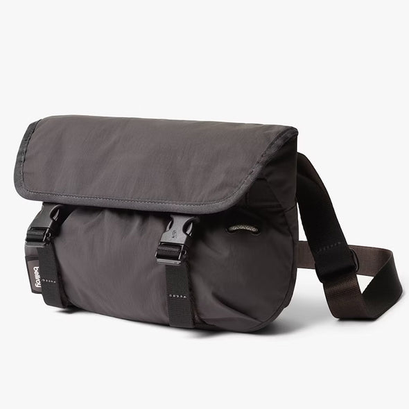 Gray shoulder bag with a strap on a white background
