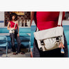 Two people wearing white crossbody bags in a diner setting.