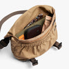 Brown bag with items inside on a white background