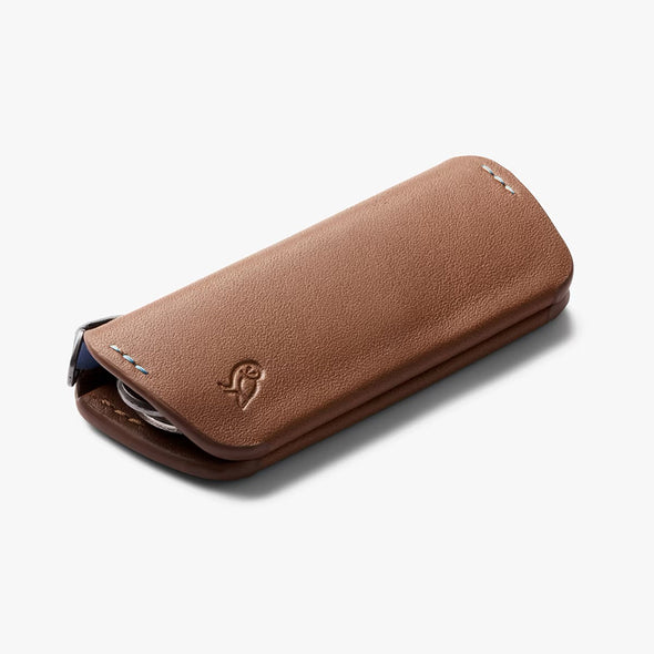 Brown leather case with a brand logo on a white background