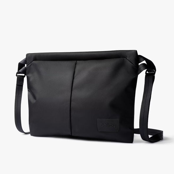 Black shoulder bag with a visible brand logo on a white background