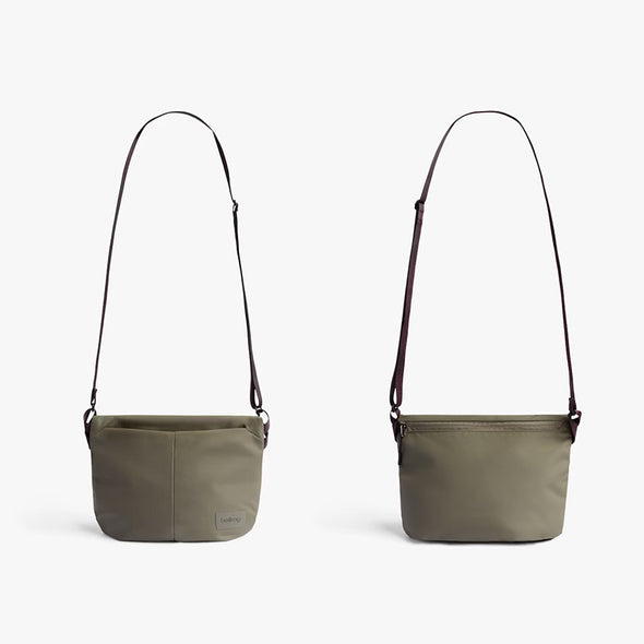 Two beige shoulder bags with brown straps on a white background