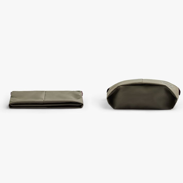 Two green fabric items on a white background