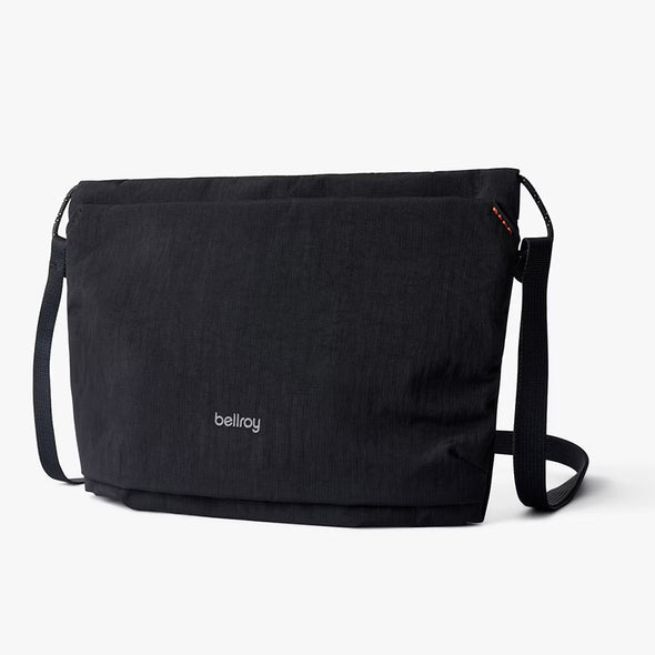 Black messenger bag with 'bellroy' branding on a white background