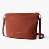 Brown shoulder bag with 'bellroy' branding on a white background