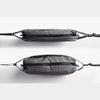 Two gray mesh bags with black straps on a white background