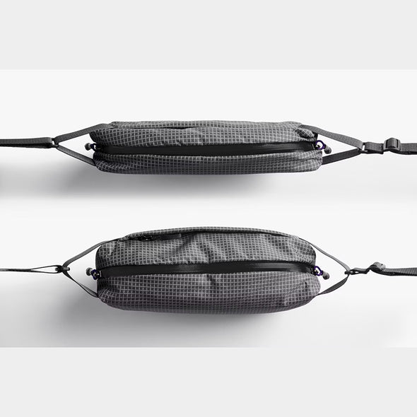 Two gray mesh bags with black straps on a white background