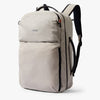 Beige backpack with black straps on a white background