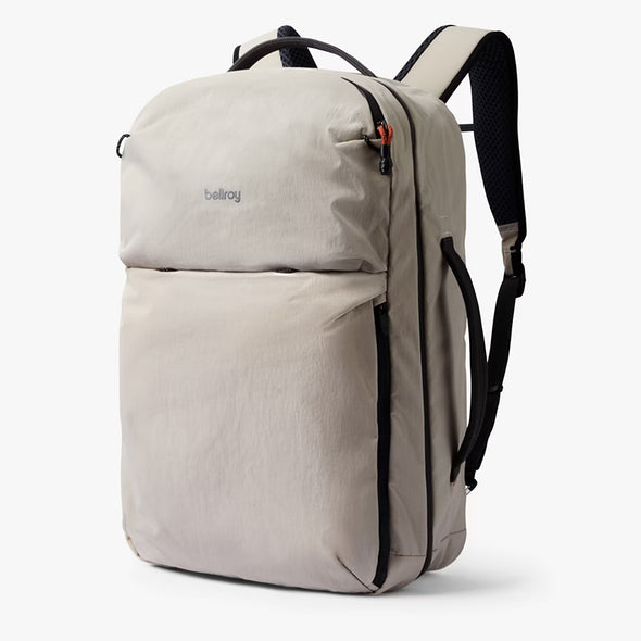 Beige backpack with black straps on a white background