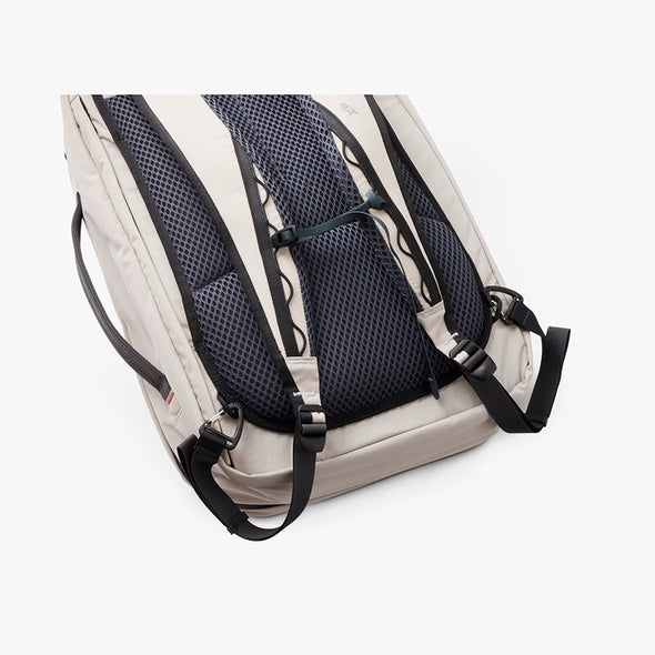 Backpack with black mesh back panel on a white background