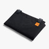 Black folded Bellroy Market Tote with an orange label on a white background