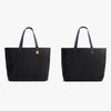 Two black tote bags on a white background