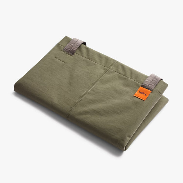 Folded Bellroy Market Tote in Willow green with orange tag on a white background