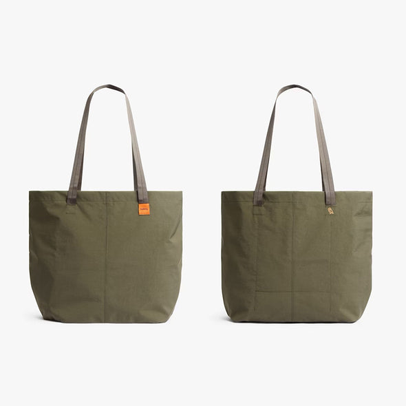 Two green tote bags with brown handles on a white background