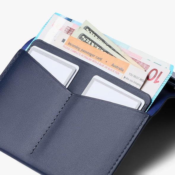 Blue wallet with cards and documents on a white background