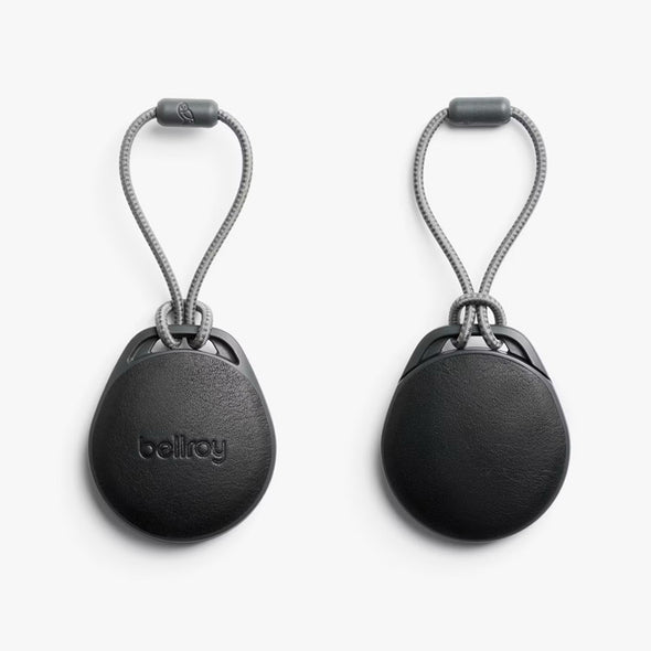 Two black keychain devices with rope loops on a white background, featuring the Bellroy brand.