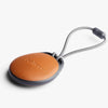 Round brown keychain with a gray cord and 'bellroy' branding on a white background