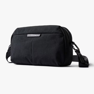 Black crossbody bag on a white background