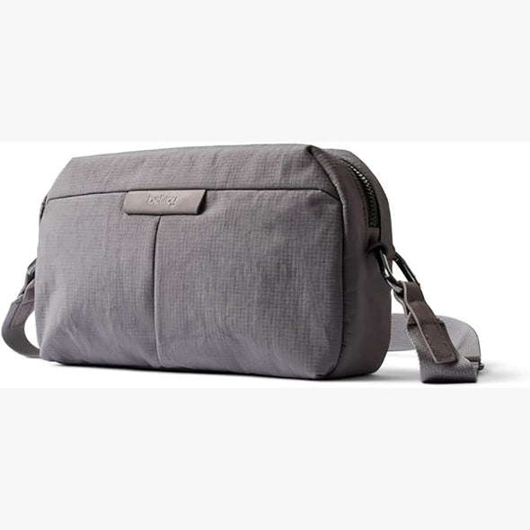 Gray shoulder bag with a visible brand logo on a white background