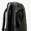 Green backpack with a water bottle holder on a white background
