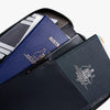 Passport holder with Australian passport and other travel documents on a white background