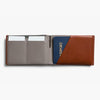 Two-tone leather wallet with card slots and passport holder on a white background