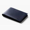 Navy blue leather wallet on a white background