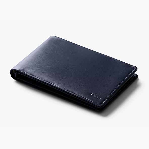 Navy blue leather wallet on a white background