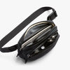 Black waist bag with multiple compartments on a white background