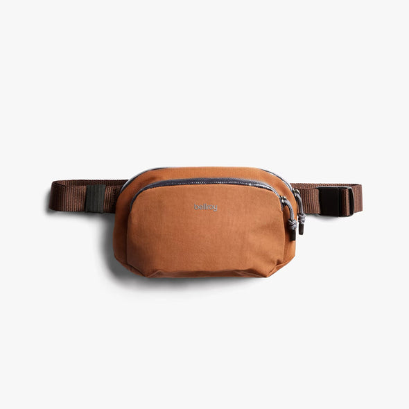 Brown waist bag with a visible brand logo on a white background