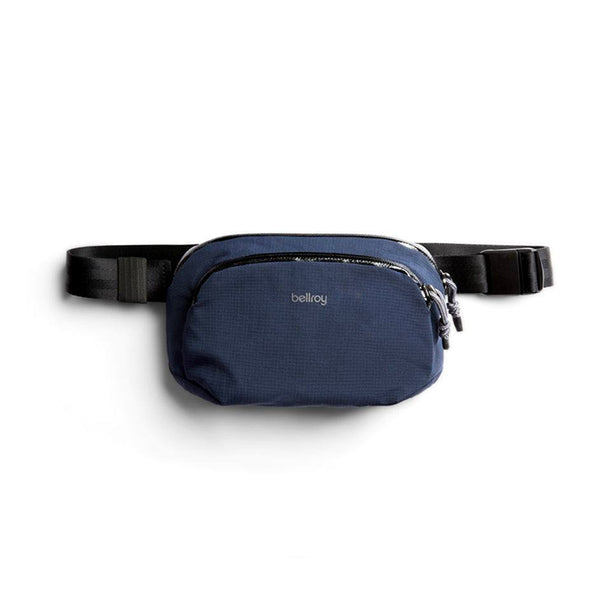 Navy blue waist bag with a black belt on a white background