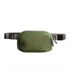 Green waist bag with a visible brand logo on a white background