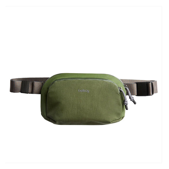Green waist bag with a visible brand logo on a white background