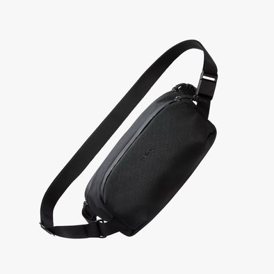Black sling bag on a white background