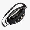 Black Bellroy Venture Ready Sling 2.5L with multiple compartments on a white background