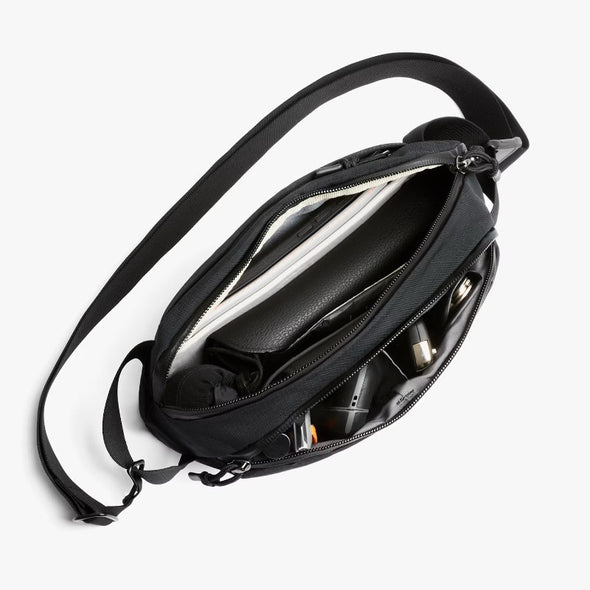 Black Bellroy Venture Ready Sling 2.5L with multiple compartments on a white background