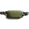 Green waist bag with a visible brand logo on a white background