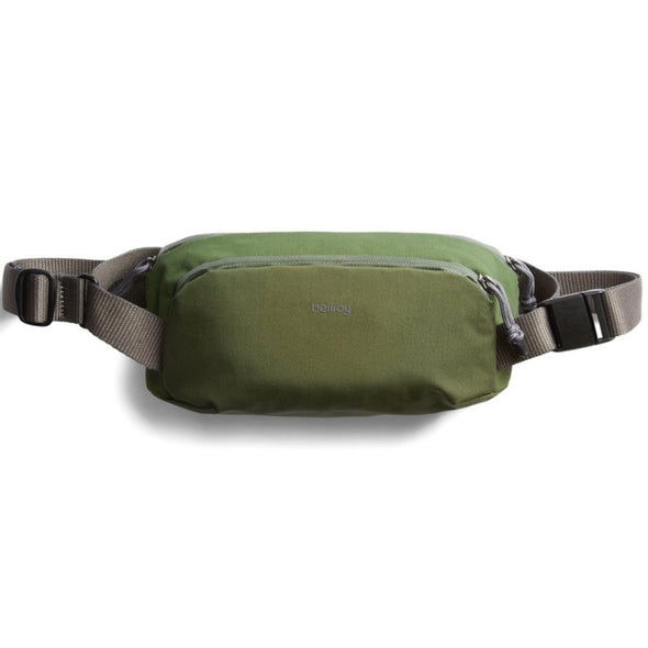 Green waist bag with a visible brand logo on a white background