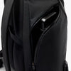Close-up of a black backpack with a shoulder strap and zipper details on a white background