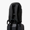 Bellroy Venture Travel Pack 26L Jet Black sits on top of a suit case