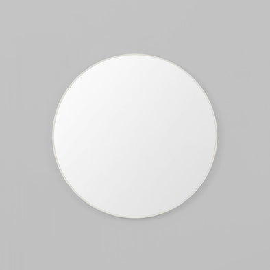 Round white mirror on a grey background