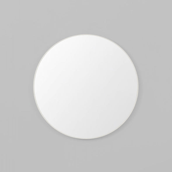 Round white mirror on a grey background