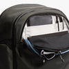 Open Bellroy Transit Workpack Pro 28L Olive backpack with compartments and items inside on a white background