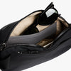 Black bag with sunglasses inside on a white background