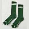 Green socks with white stripes and 'LEMON SHOPPE' branding on a light gray background